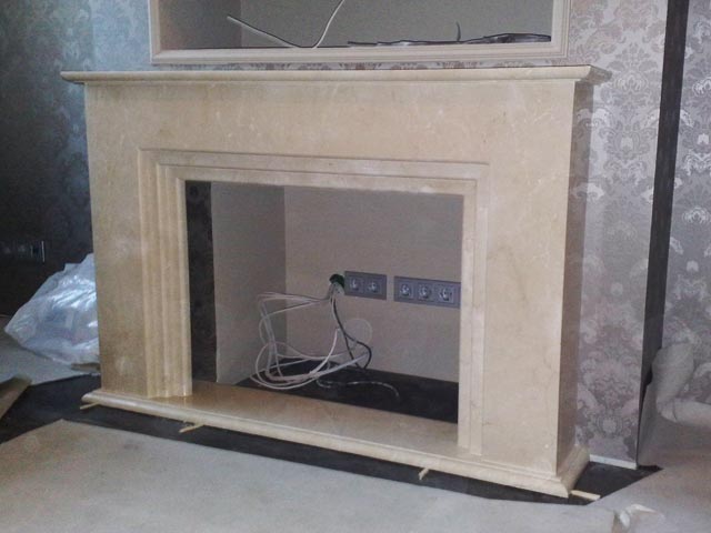 Assemblage of details of a fireplace from marble Crema Marfi, Spain  =>Following