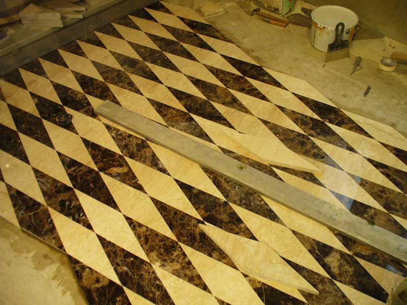 Facing by a natural stone of an inlaid floor.  =>Following