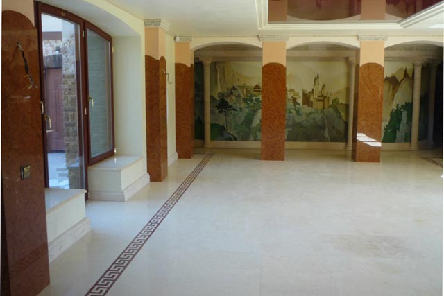 Facing of a floor by marble with application of mosaic elements.  =>Following