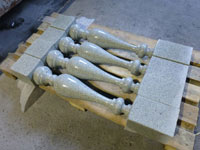 A sample of turned balusters from gray-green granite